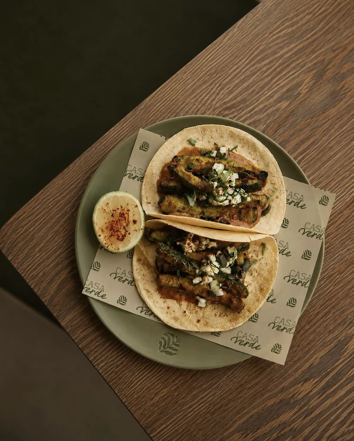 Two tacos on Casa Verde branded paper